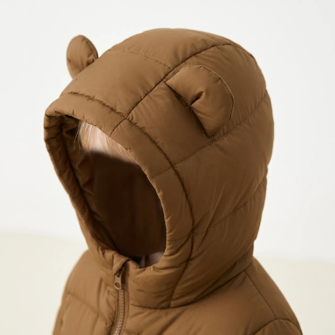 Doudoune à capuche Ours — Le détail qui fait tout